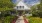 a house with trees and greenery
