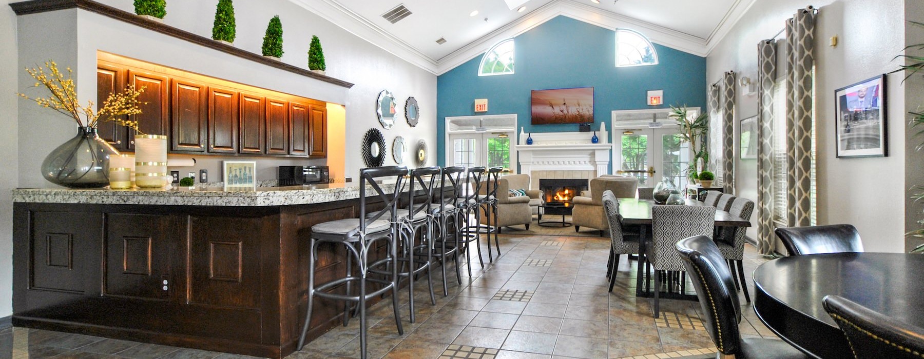 a clubhouse room with tables and chairs