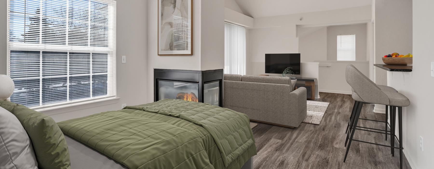 a bedroom with a bed and a couch