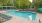 a swimming pool with chairs