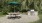 an outdoor grill area with a bench and an umbrella