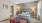 a bedroom with a bed and a lamp