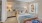 a bedroom with a bed and lamps