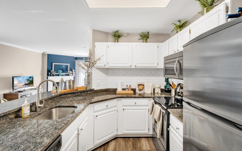a kitchen with white cabinets